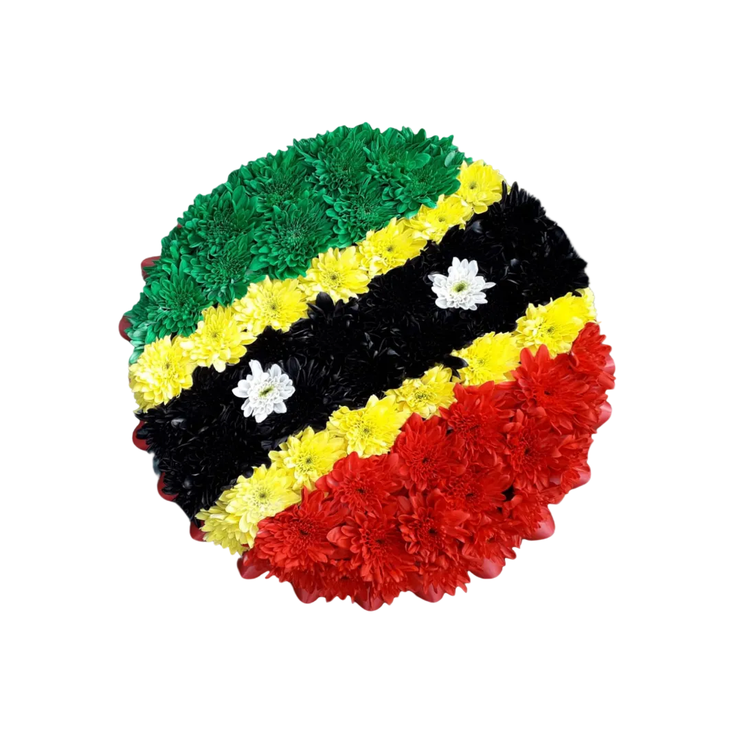A floral arrangement in the colors of the St Kitts & Nevis flag, with a circular design formed by different colored flowers.