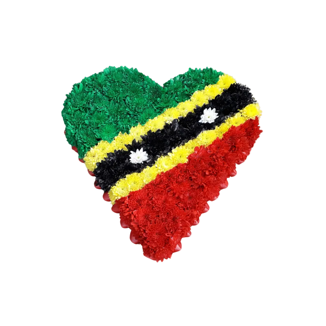 A heart-shaped floral tribute arranged in the colors of the St Kitts & Nevis flag.